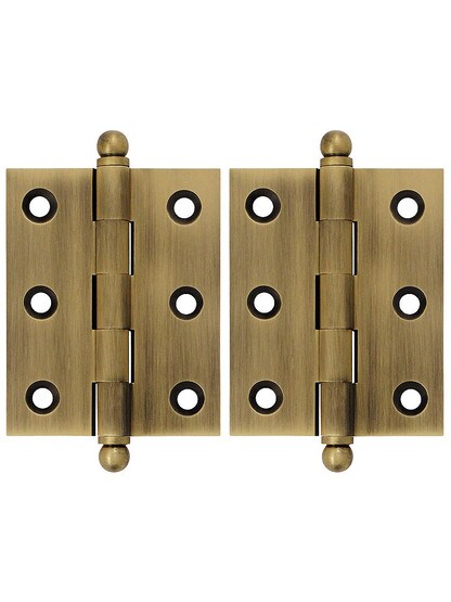 Pair of Solid Brass Cabinet Hinges - 2 1/2 inch x 2 inch in Antique Brass.